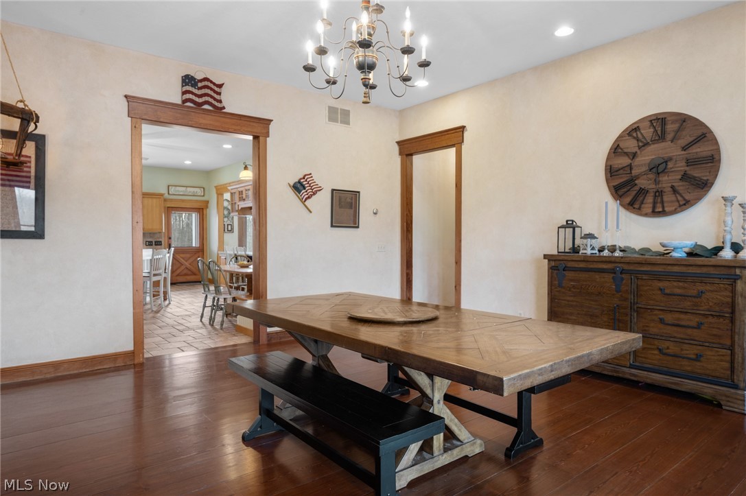 9419 Robinson Road Chardon, OH 44024 - Photo 19 of 46 Dining room with dark wood-style floors and suspended lighting