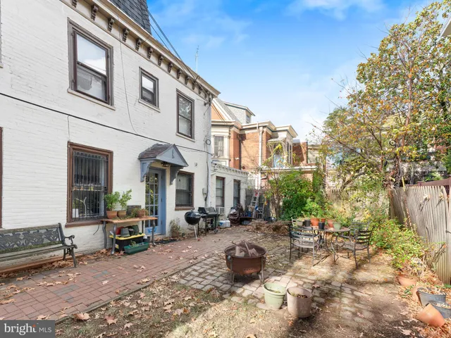 a view of a building with sitting area