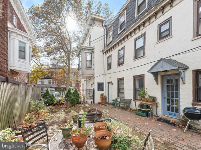 a view of a brick building with many windows