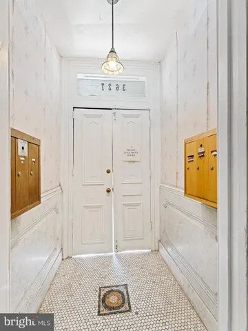 a view of an entryway with wooden floor
