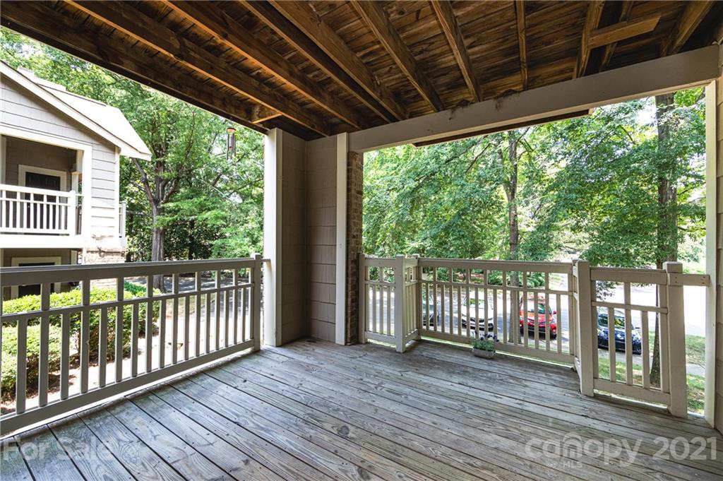 5003 Sharon Road, Unit G Charlotte, NC 28210 - Photo 14 of 42 a view of a porch with wooden floor
