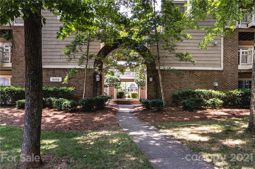 5003 Sharon Road, Unit G Charlotte, NC 28210 - Photo 2 of 42 a view of a house with backyard and garden