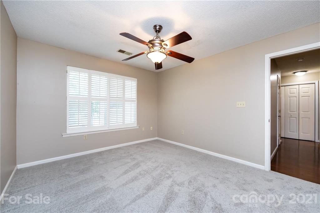 5003 Sharon Road, Unit G Charlotte, NC 28210 - Photo 29 of 42 a view of an empty room with a window