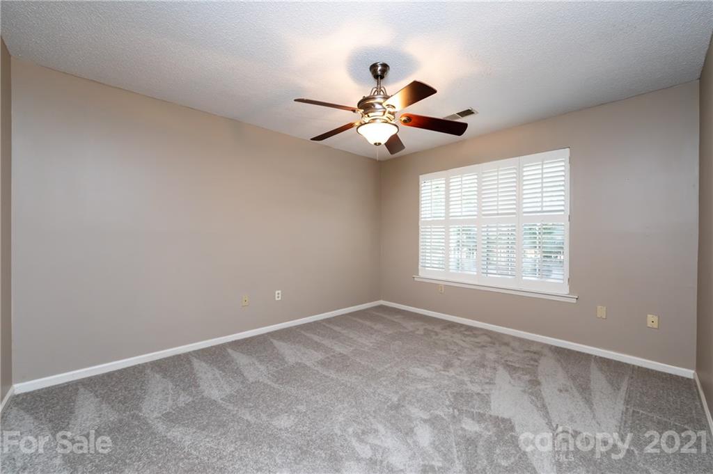 5003 Sharon Road, Unit G Charlotte, NC 28210 - Photo 30 of 42 a view of an empty room with a window