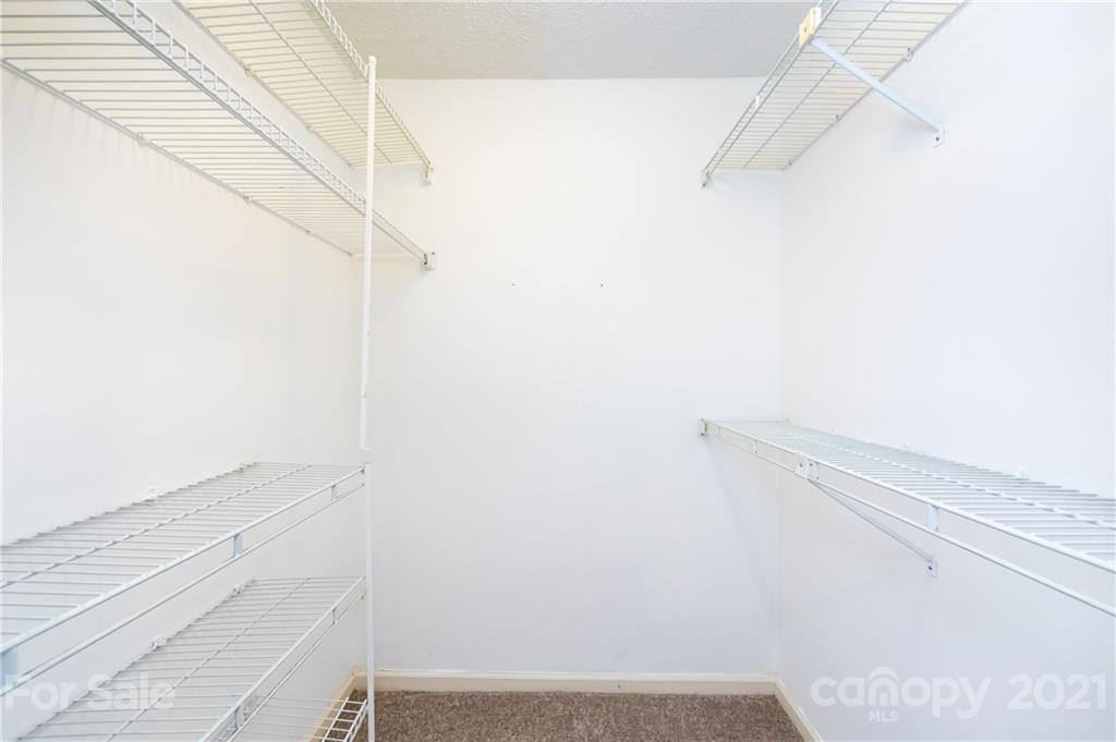 5003 Sharon Road, Unit G Charlotte, NC 28210 - Photo 31 of 42 a view of small space with racks on the wall