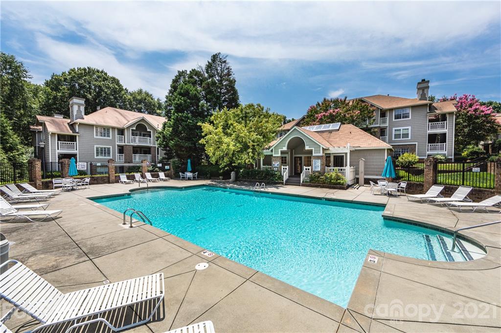 5003 Sharon Road, Unit G Charlotte, NC 28210 - Photo 34 of 42 a view of a patio with swimming pool and furniture