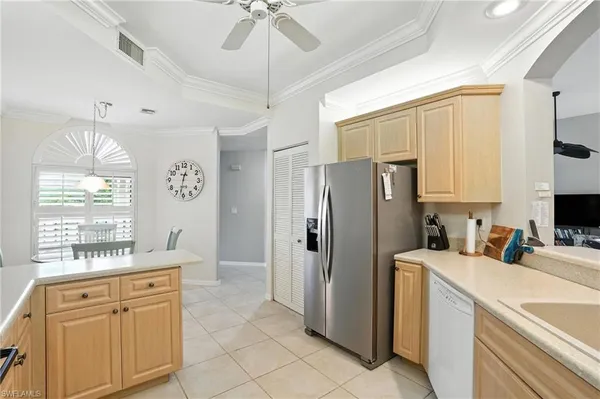 a kitchen with stainless steel appliances a refrigerator sink and microwave