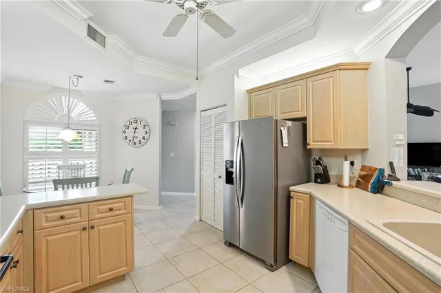 a kitchen with stainless steel appliances a refrigerator sink and microwave