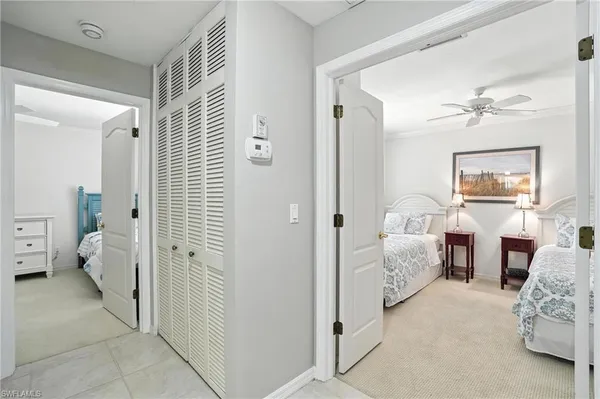 a bedroom with a bed and a mirror