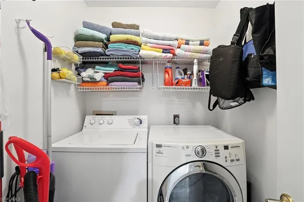 a utility room with dryer and washer