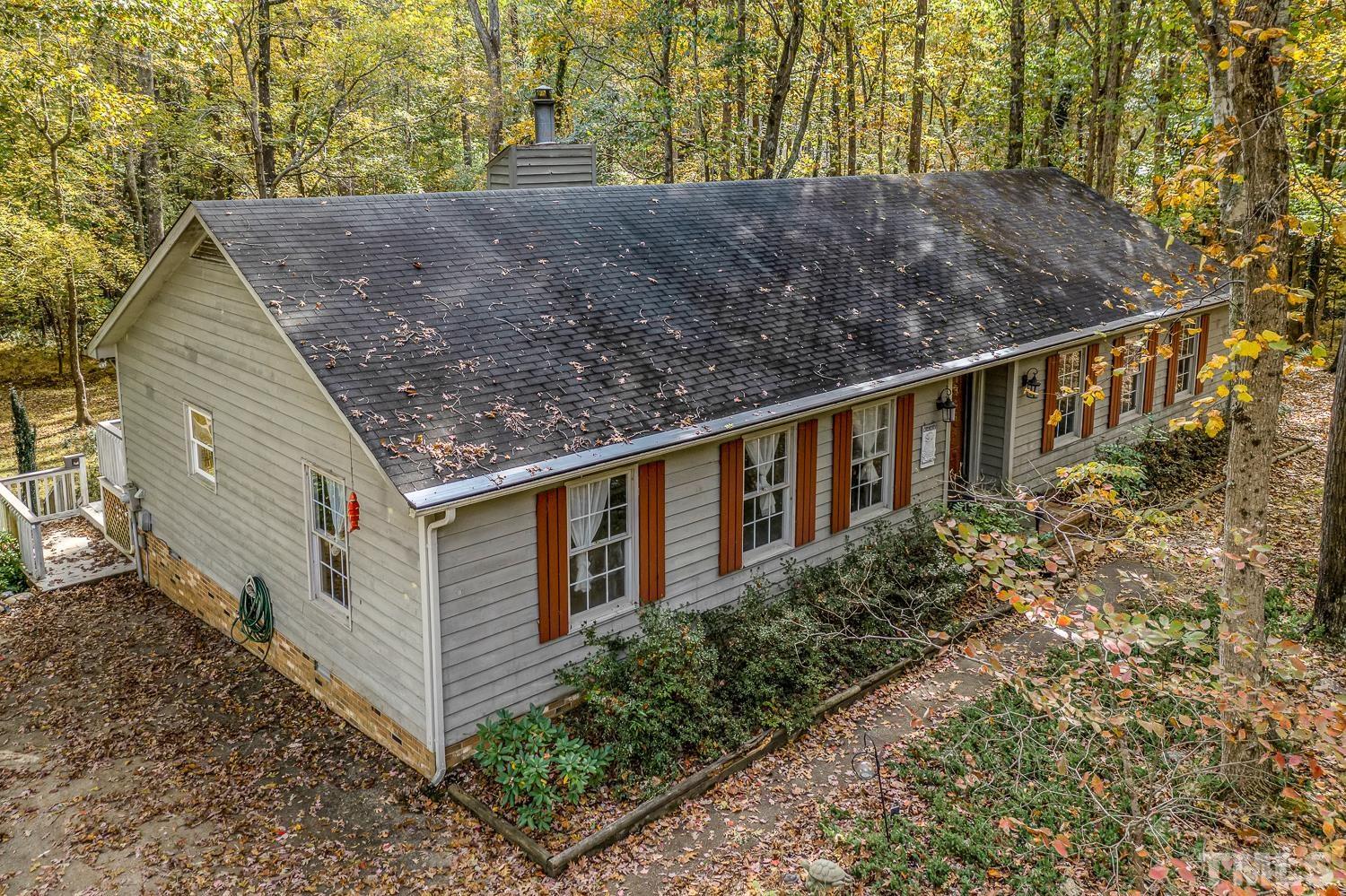 5908 Scalybark Road Durham, NC 27712 - Photo 1 of 30 a view of a house with a yard