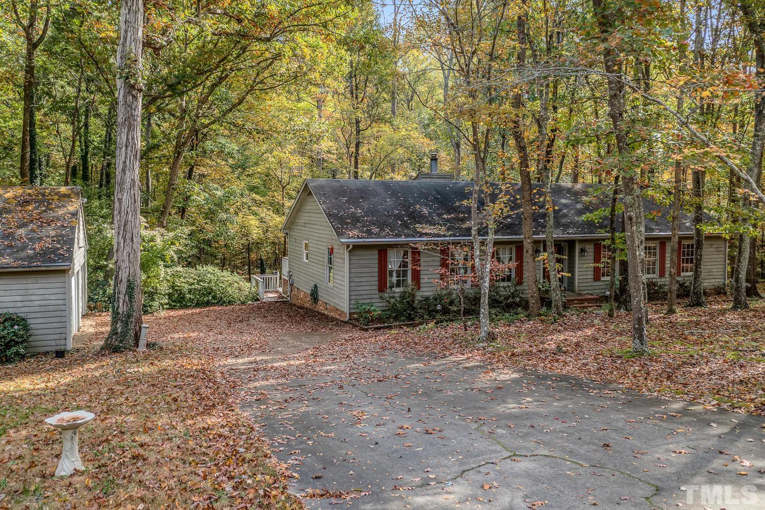 5908 Scalybark Road Durham, NC 27712 - Photo 2 of 30 a view of a house with a trees
