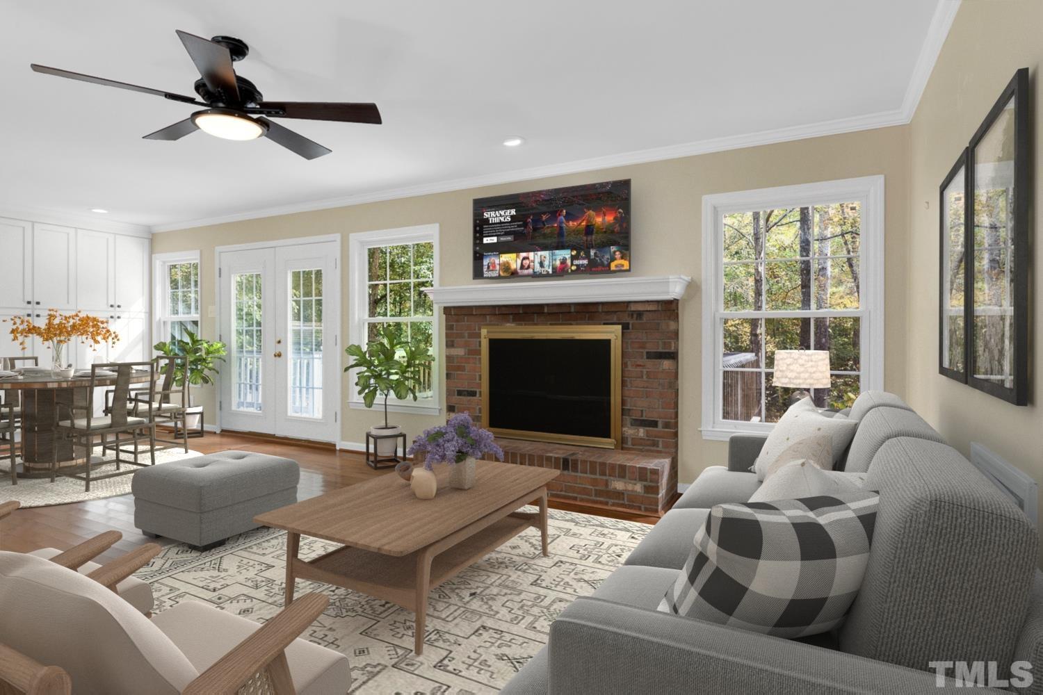 5908 Scalybark Road Durham, NC 27712 - Photo 13 of 30 a living room with furniture a window and a fireplace