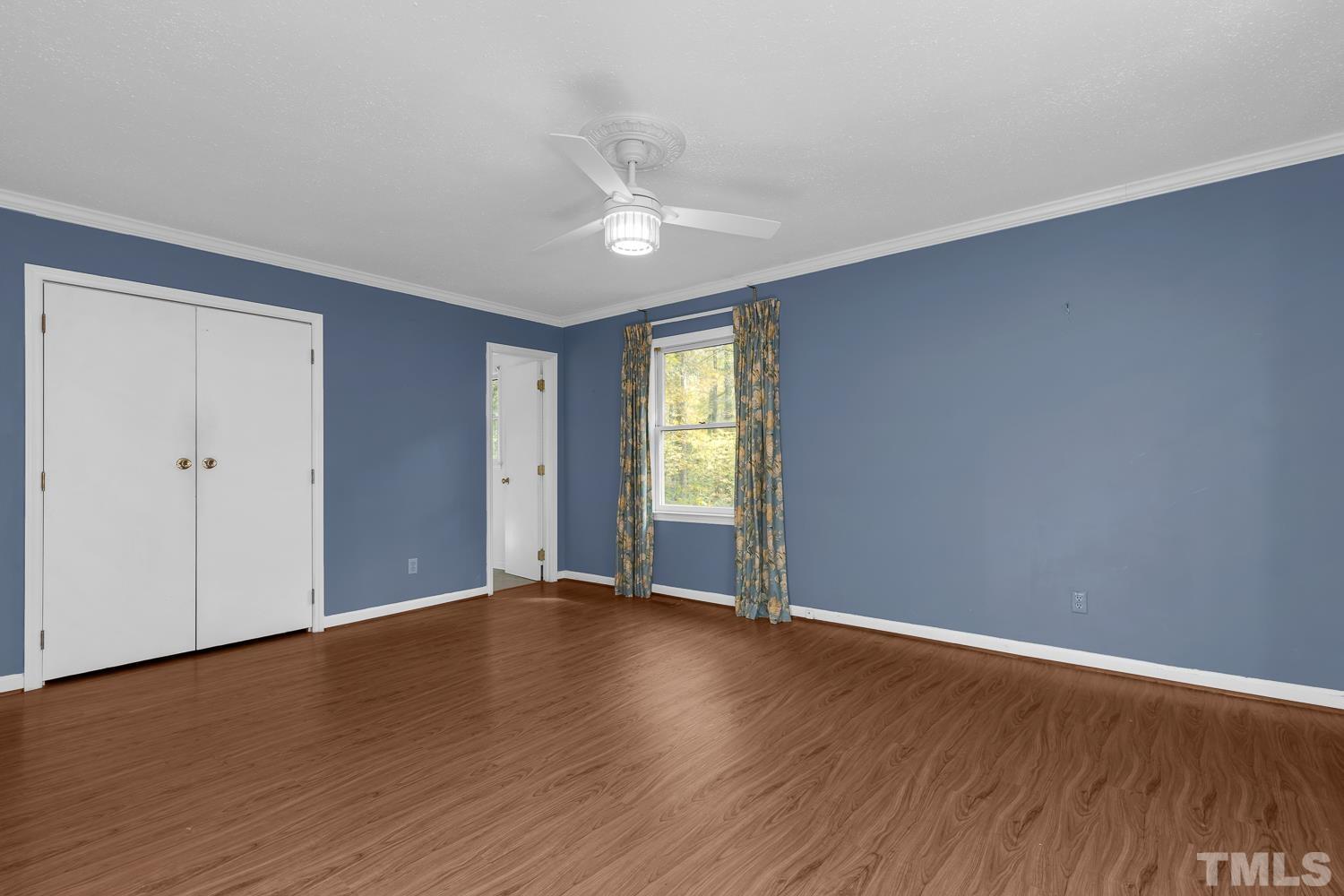 5908 Scalybark Road Durham, NC 27712 - Photo 23 of 30 an empty room with wooden floor and windows