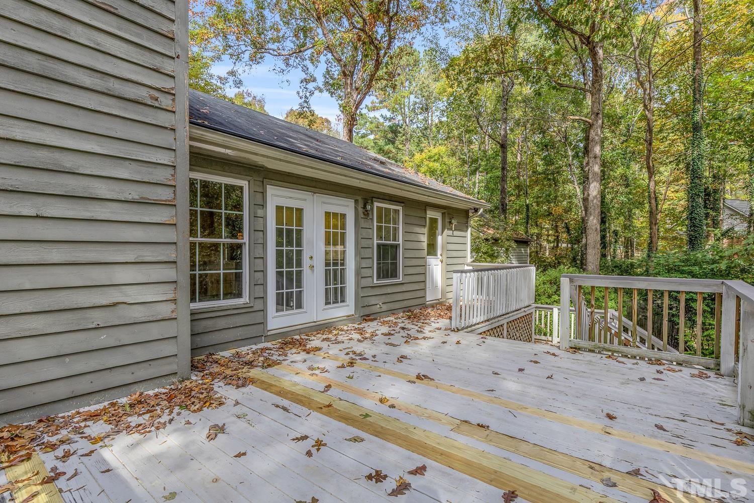 5908 Scalybark Road Durham, NC 27712 - Photo 26 of 30 a view of house with backyard and wooden fence