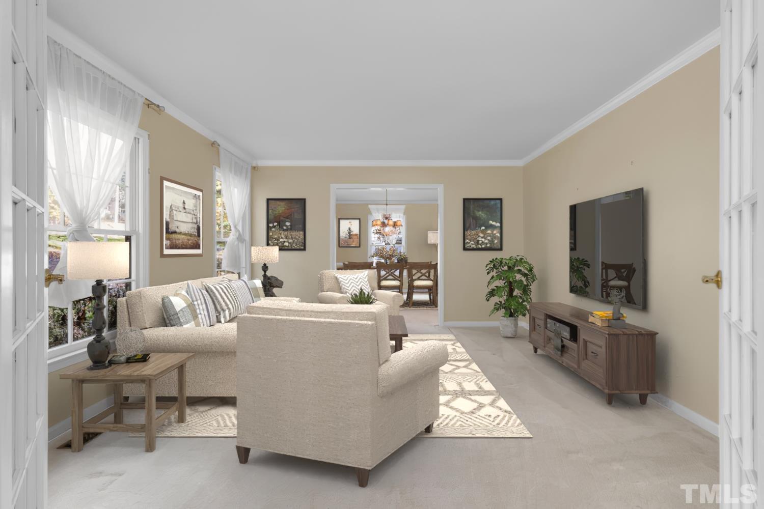 5908 Scalybark Road Durham, NC 27712 - Photo 5 of 30 a living room with furniture and a flat screen tv