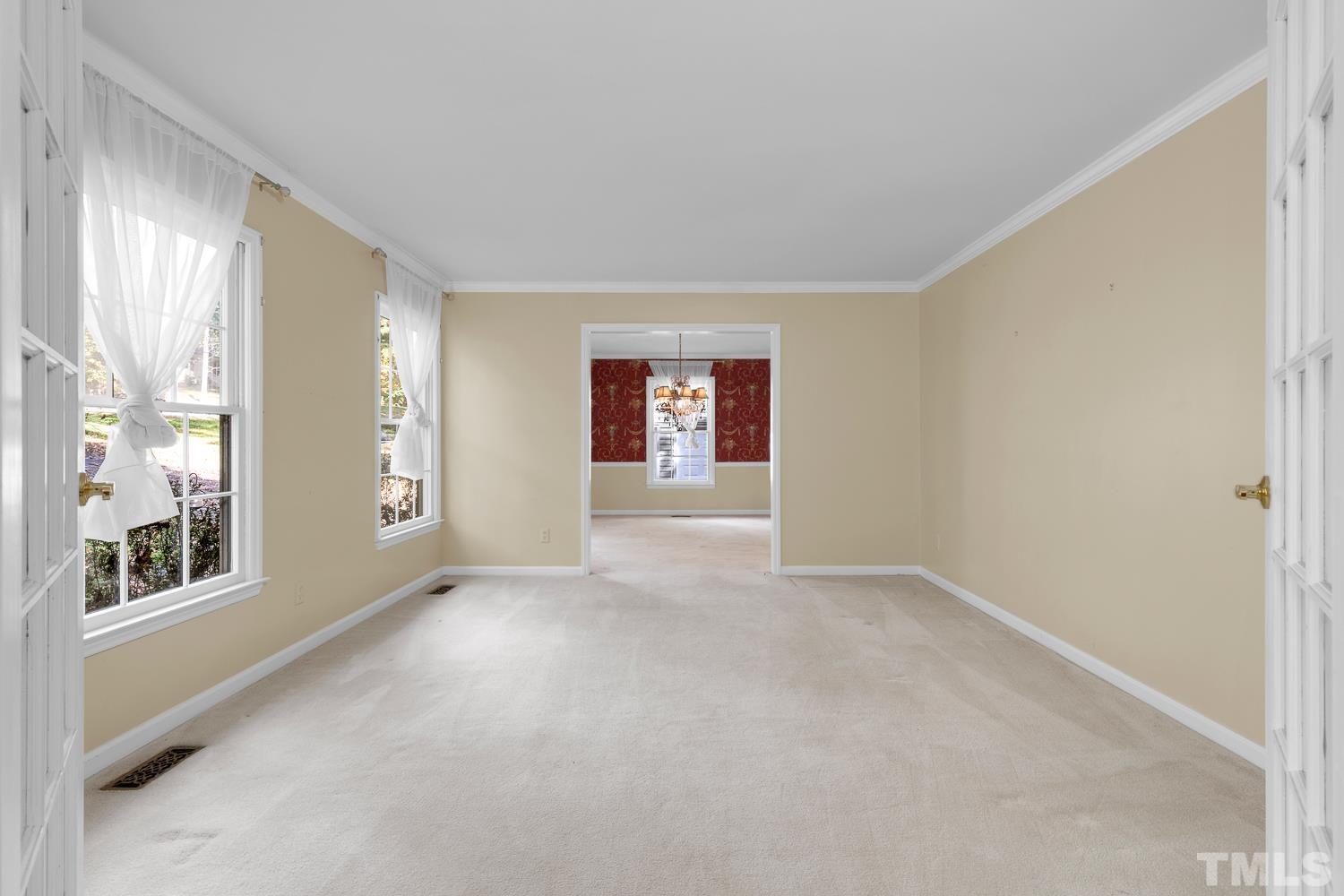 5908 Scalybark Road Durham, NC 27712 - Photo 6 of 30 a view of an empty room with a window