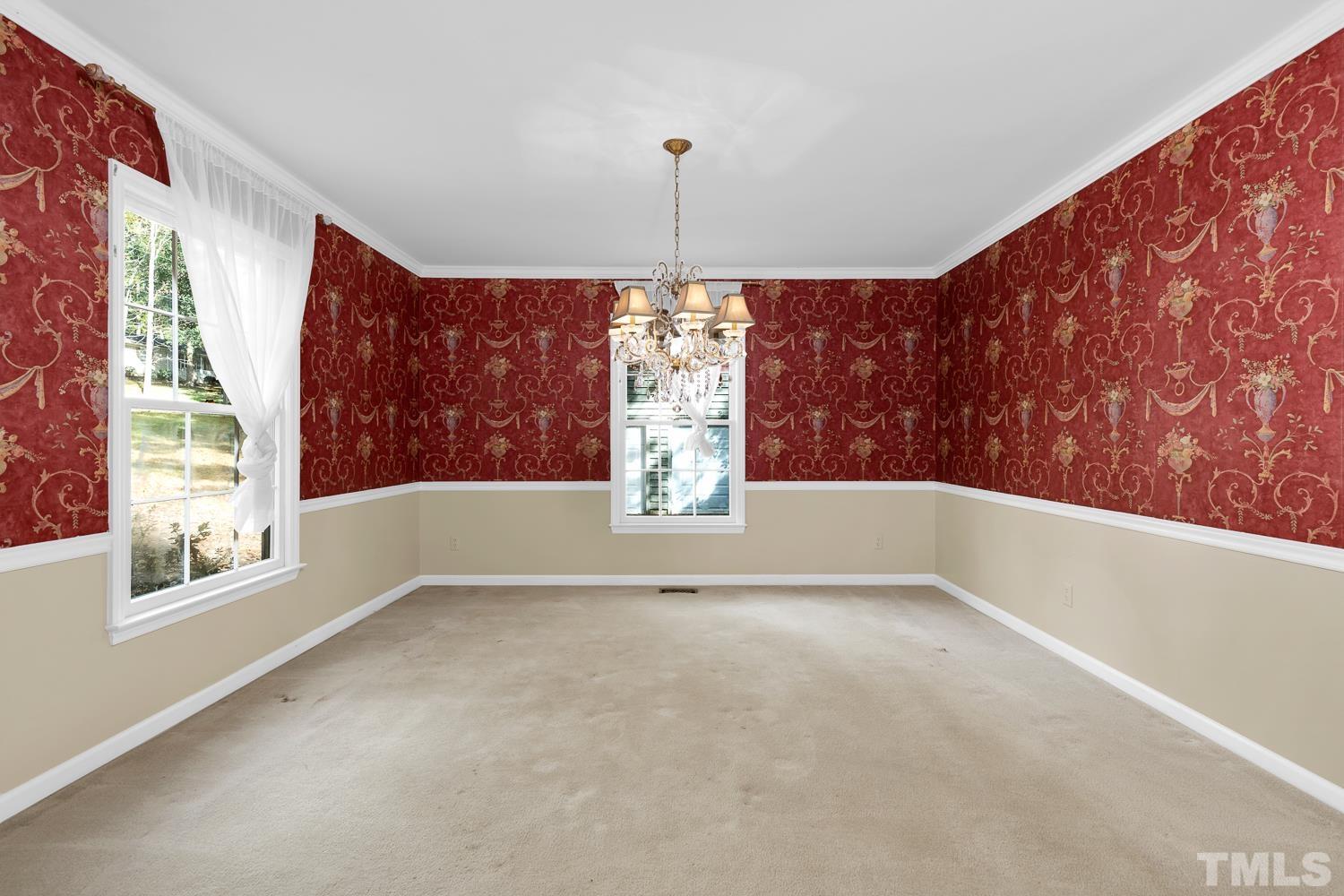 5908 Scalybark Road Durham, NC 27712 - Photo 9 of 30 a view of empty room with window chandelier and table