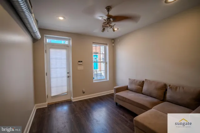 a living room with furniture and a window
