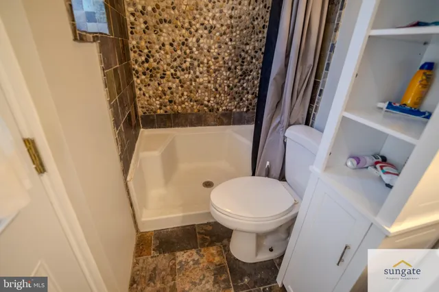 a bathroom with a sink and toilet