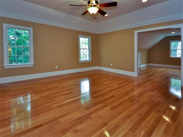 46 Whiting Way Needham, MA 02492 - Photo 13 of 24 a view of an empty room with wooden floor and a window