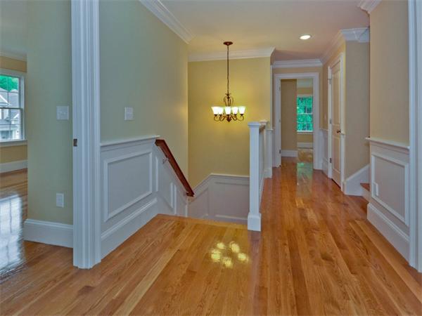 46 Whiting Way Needham, MA 02492 - Photo 14 of 24 a view of a hallway with wooden floor and staircase