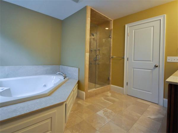 46 Whiting Way Needham, MA 02492 - Photo 17 of 24 a bathroom with a tub and shower