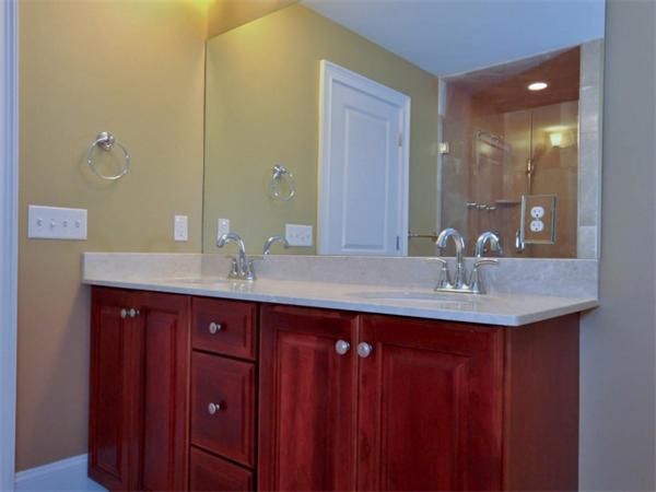 46 Whiting Way Needham, MA 02492 - Photo 18 of 24 a bathroom with double vanity sinks and a mirror