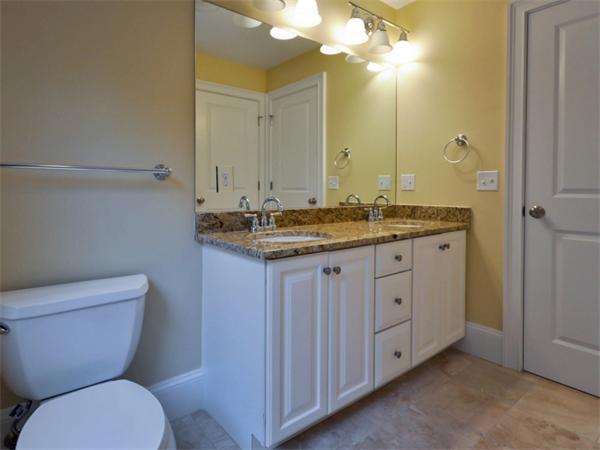 46 Whiting Way Needham, MA 02492 - Photo 19 of 24 a bathroom with a granite countertop toilet sink and mirror