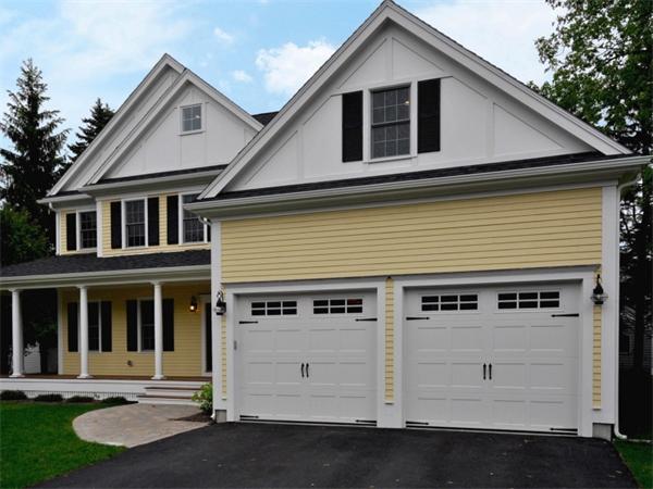 46 Whiting Way Needham, MA 02492 - Photo 2 of 24 a front view of a house with garage