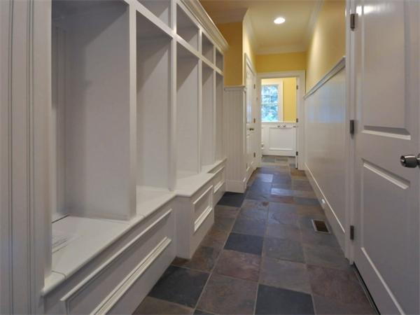 46 Whiting Way Needham, MA 02492 - Photo 22 of 24 a view of a hallway with wooden floor and staircase