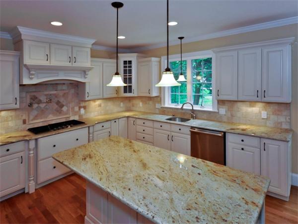 46 Whiting Way Needham, MA 02492 - Photo 7 of 24 a kitchen with kitchen island granite countertop a sink window and cabinets