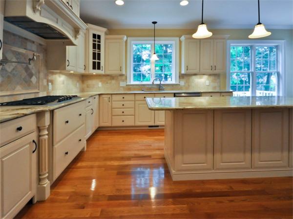 46 Whiting Way Needham, MA 02492 - Photo 8 of 24 a kitchen with granite countertop a stove a sink and a chandelier