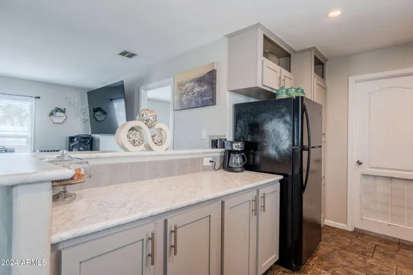 a kitchen with a stove and a microwave