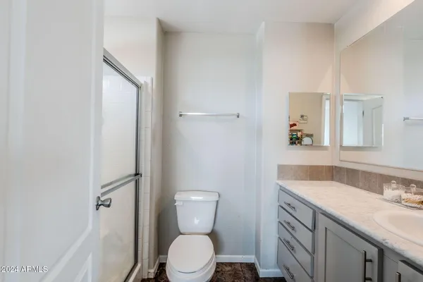 a bathroom with a sink and vanity