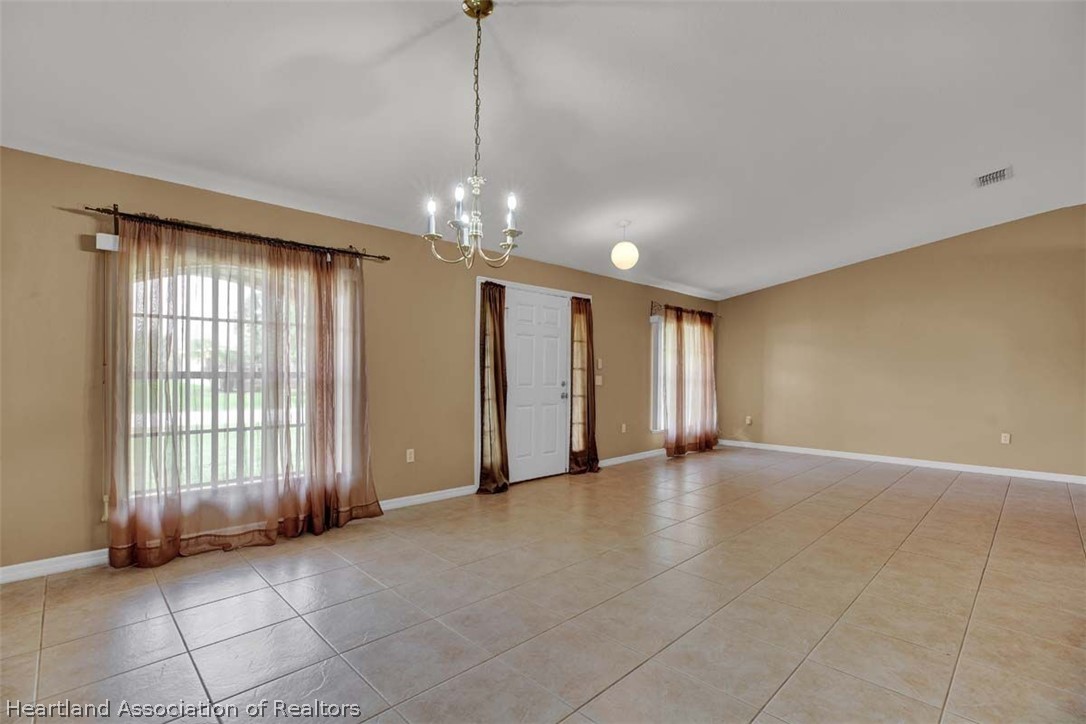 4755 Tarrega Street Sebring, FL 33872 - Photo 11 of 35 a view of an empty room with a window