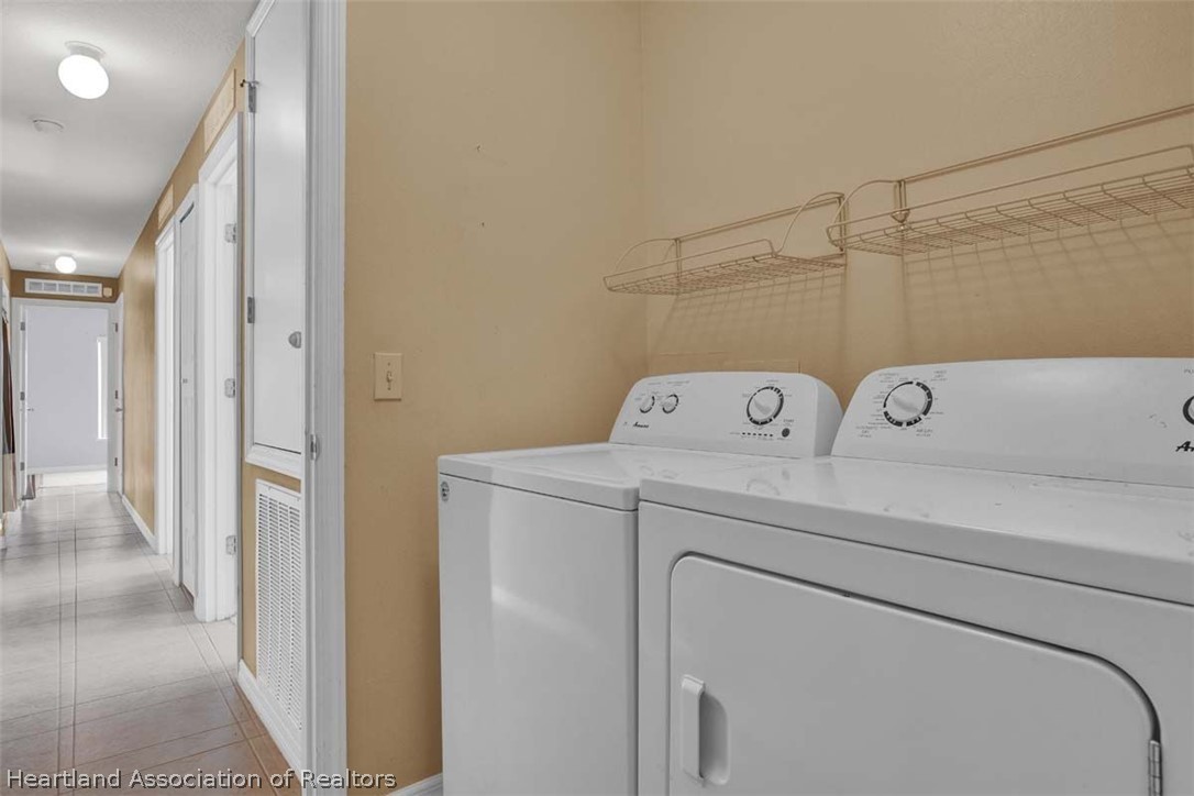 4755 Tarrega Street Sebring, FL 33872 - Photo 12 of 35 a utility room with dryer and washer