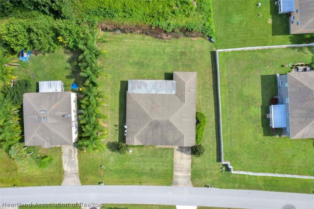 4755 Tarrega Street Sebring, FL 33872 - Photo 15 of 35 an aerial view of a house with a yard