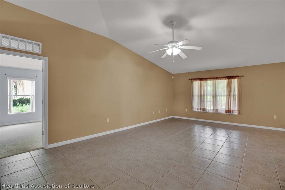 4755 Tarrega Street Sebring, FL 33872 - Photo 16 of 35 a view of an empty room with a window