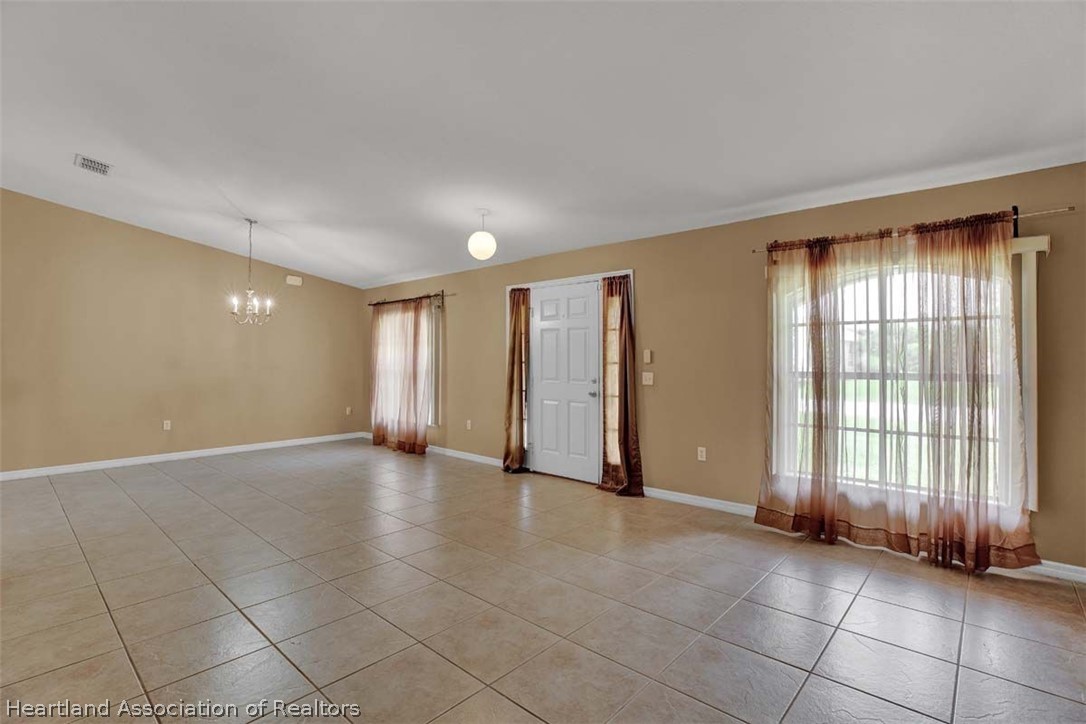 4755 Tarrega Street Sebring, FL 33872 - Photo 20 of 35 a view of an empty room with a window