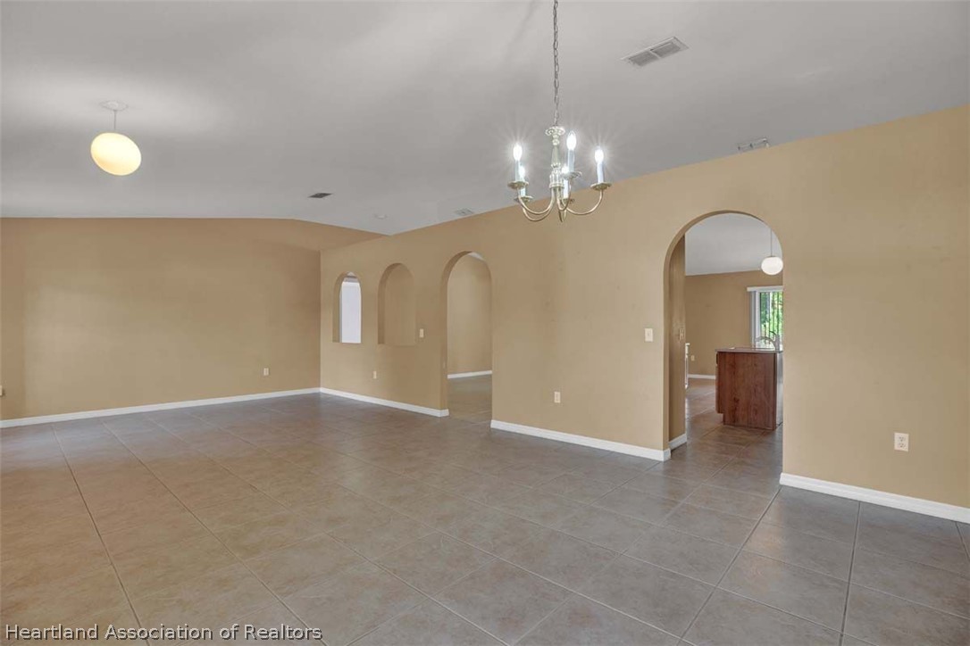 4755 Tarrega Street Sebring, FL 33872 - Photo 26 of 35 a view of a chandelier and a chandelier in a room