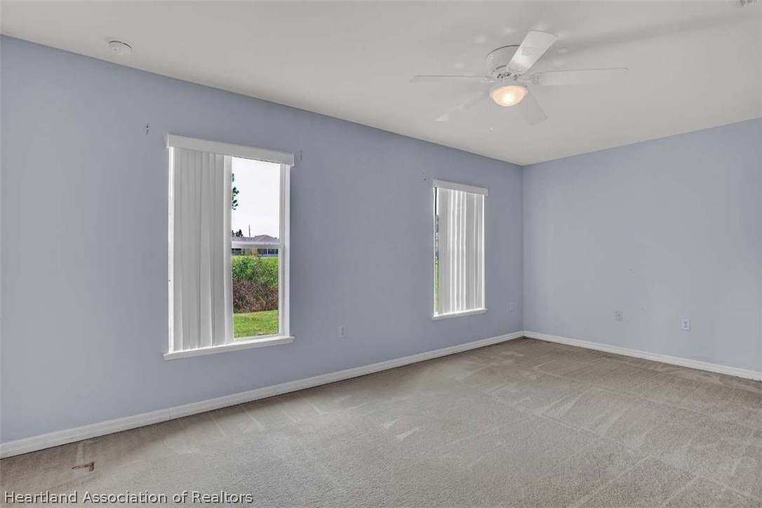 4755 Tarrega Street Sebring, FL 33872 - Photo 27 of 35 an empty room with windows and closet