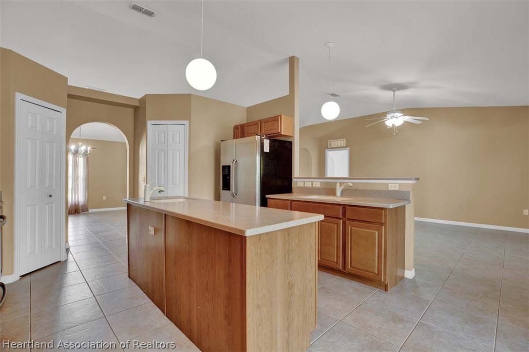 4755 Tarrega Street Sebring, FL 33872 - Photo 3 of 35 a spacious bathroom with a sink and a mirror