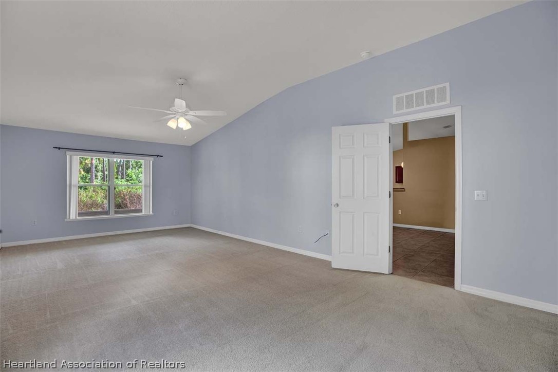 4755 Tarrega Street Sebring, FL 33872 - Photo 4 of 35 an empty room with windows and view