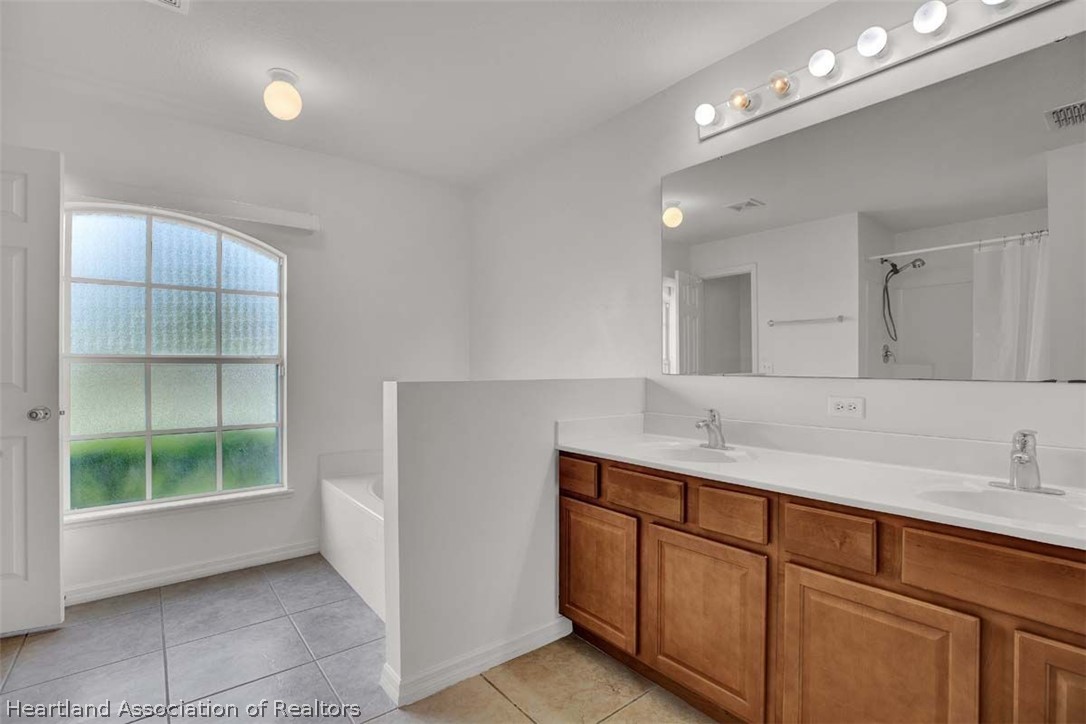 4755 Tarrega Street Sebring, FL 33872 - Photo 7 of 35 a bathroom with a sink and a mirror