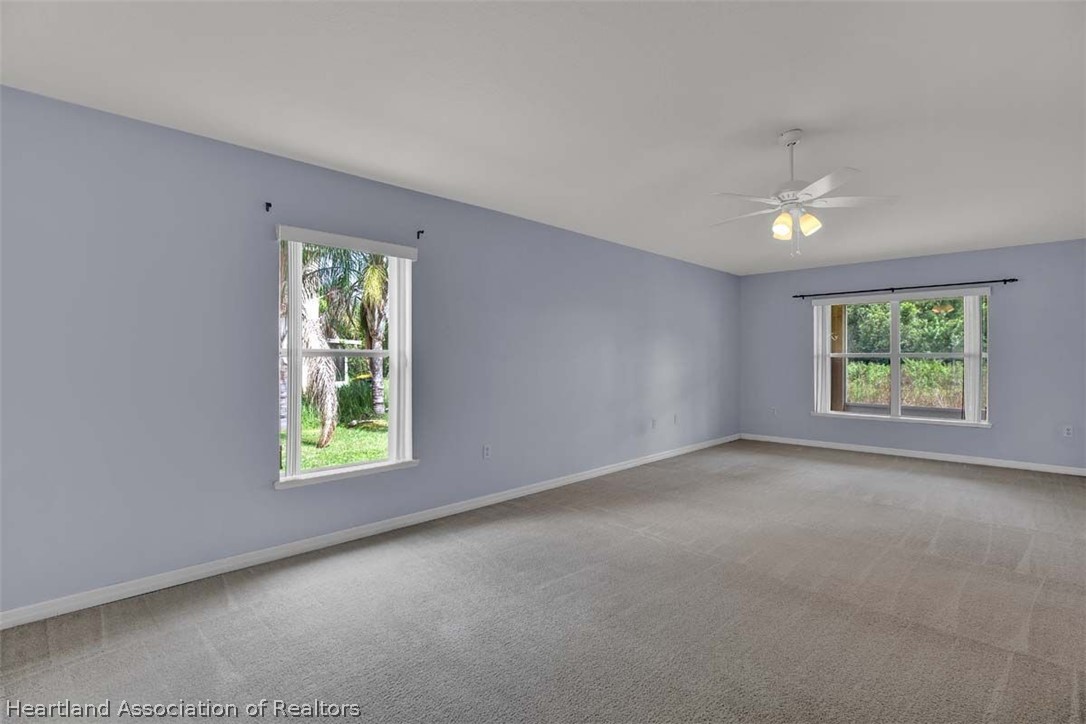 4755 Tarrega Street Sebring, FL 33872 - Photo 8 of 35 an empty room with windows and closet