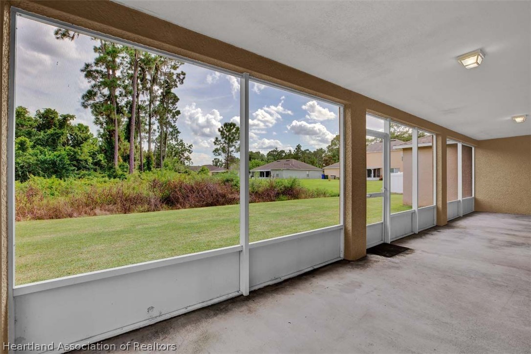 4755 Tarrega Street Sebring, FL 33872 - Photo 9 of 35 a view of an outdoor space with a big yard