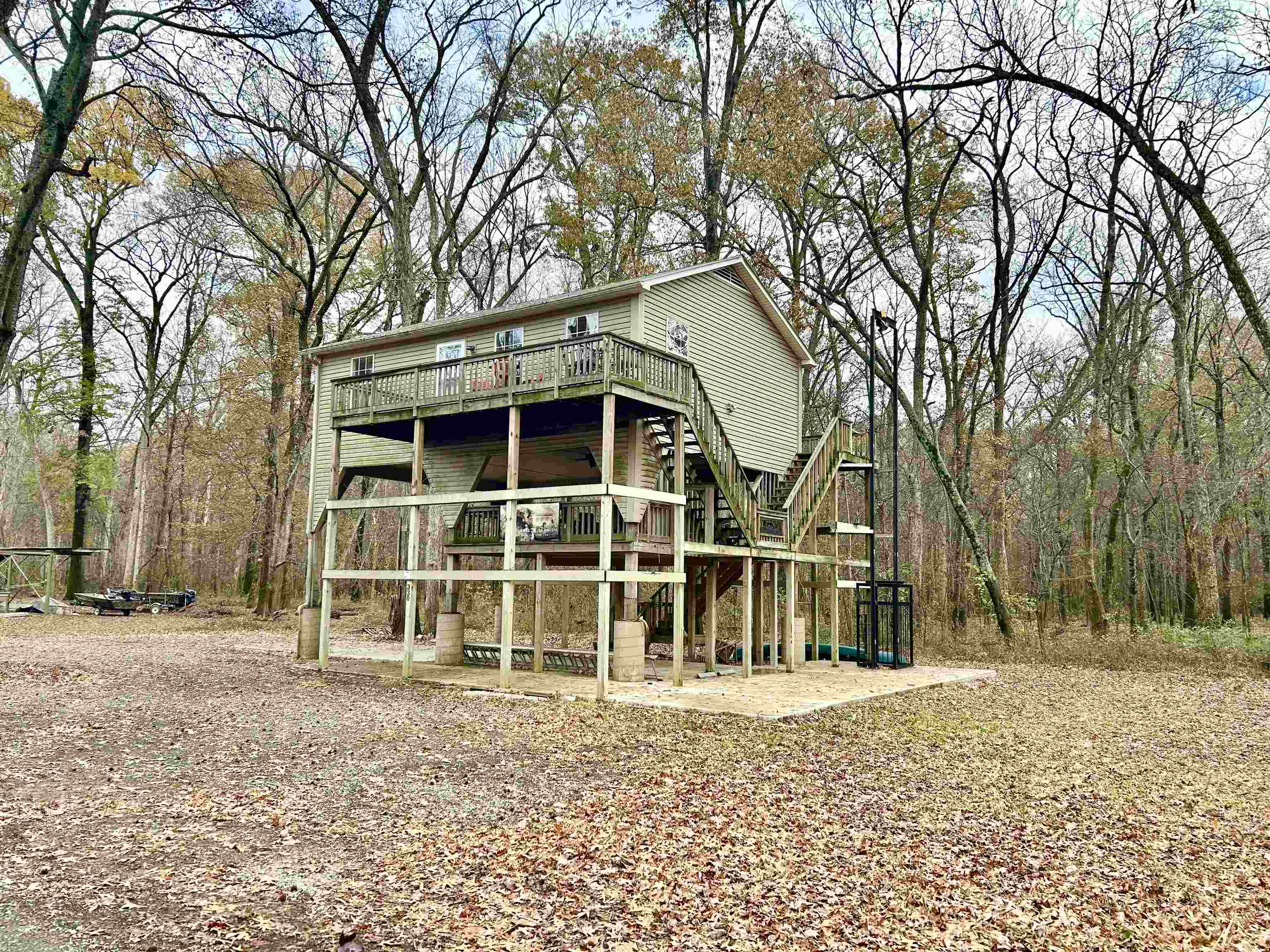 330 Chisholm Lake Camp Road Ripley, TN 38063 - Photo 3 of 13 a house with trees in front of it