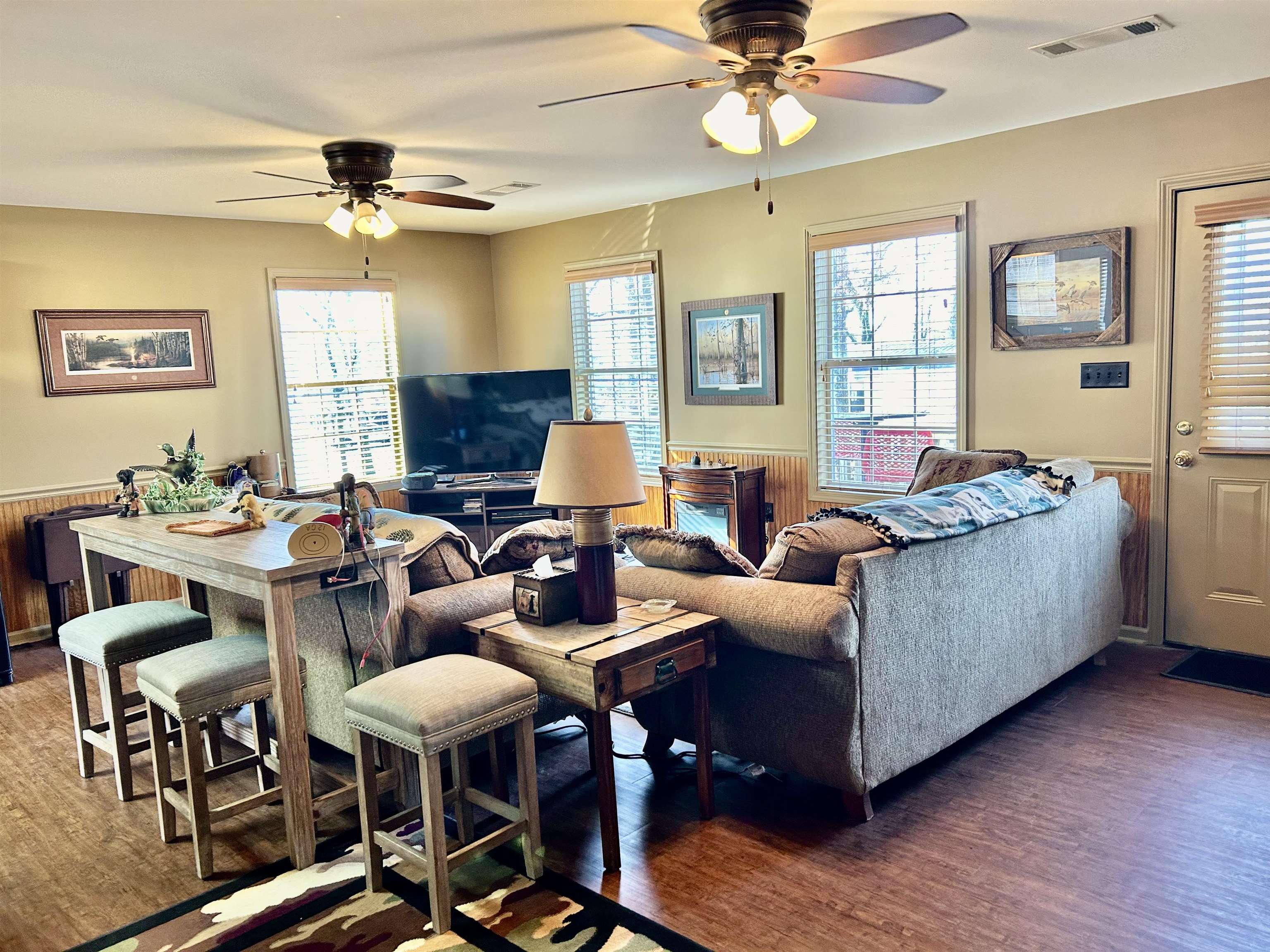 330 Chisholm Lake Camp Road Ripley, TN 38063 - Photo 7 of 13 a living room with furniture a chandelier and a window