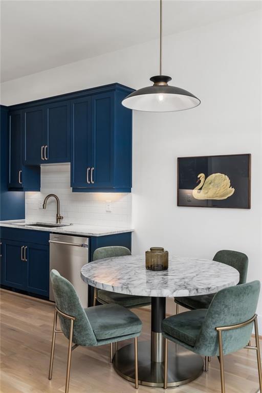 699 Eustace Street Southeast Atlanta, GA 30315 - Photo 11 of 53 a kitchen with granite countertop a table chairs stove and cabinets